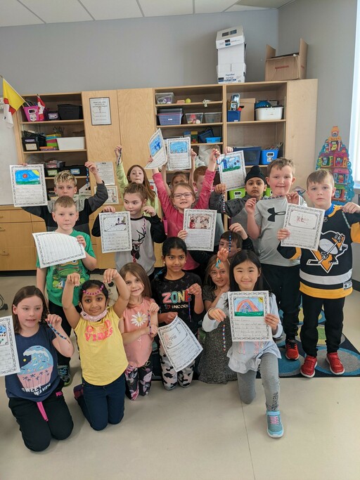 Grade 2 students at SouthPointe School students display the letters they sent to pen pals at St. Theresa School in Wabasca, Alta.