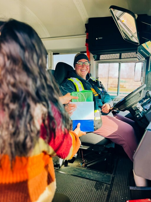 A bus driver receives a token of gratitude for this year’s Bus Driver Appreciation Day.