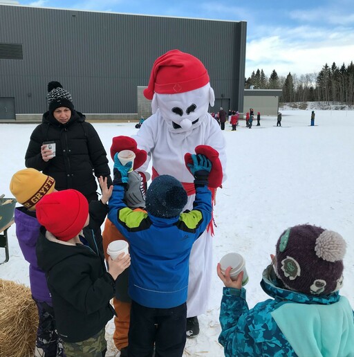 The Bonhomme Carnaval mascot visits Ardrossan Elementary students at their Carnaval celebration.
