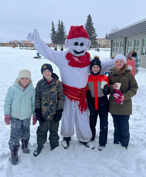 Students at Ardrossan Elementary enjoy the festivities with the Bonhomme Carnaval mascot at the school’s Winter Carnaval.
