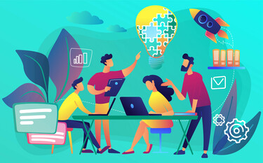 A colourful cartoon graphic of four faceless adults sitting and standing around a table brainstorming ideas. Set against a turquoise background with a large lightbulb made up of puzzle piece shapes above their heads.