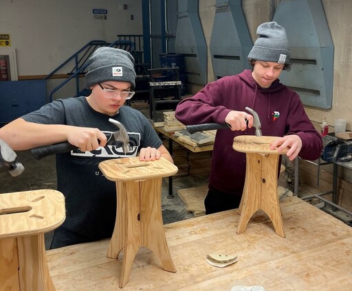 Andrew Kozley and Dirks Lochtie, students at Rudolph Hennig Junior High, craft stools in a construction classroom at Fort Saskatchewan High during one of the school’s Worker Bee Wednesdays.