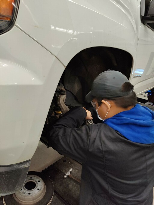 Student working in EIPS automotive shop