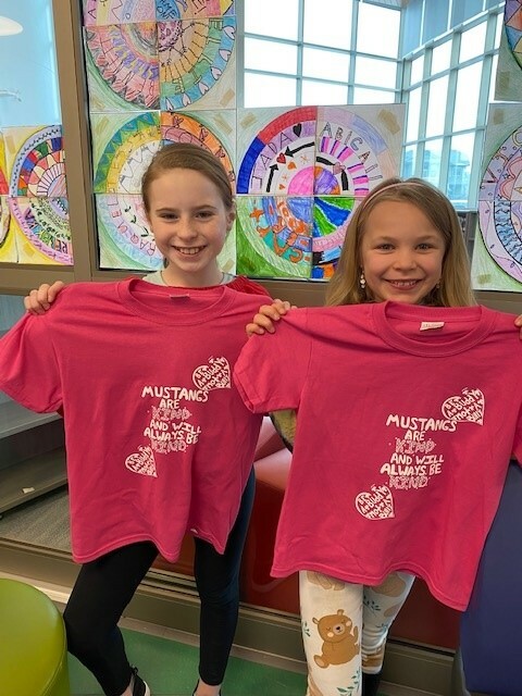 Charlotte Loy and Emilia Presse, the winners of Davidson Creek Elementary's Pink Shirt Day t-shirt contest.